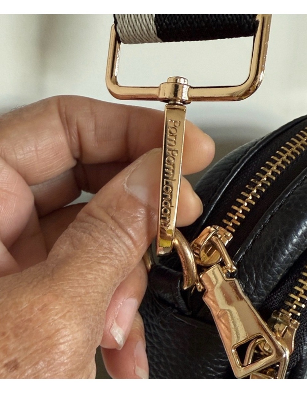Compact Black Pebble Crossbody with Patterned Strap - Picture 2 of 12